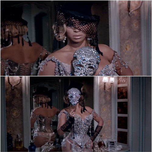 corset by Christian Lacroix, mask by Swarovski, gloves by Chanel